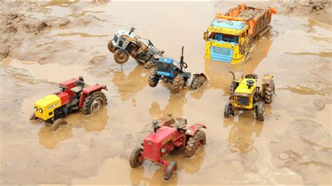 Truck Heavy Loaded Sand Stuck In Deep Mud Pulling Out Hmt Tractor