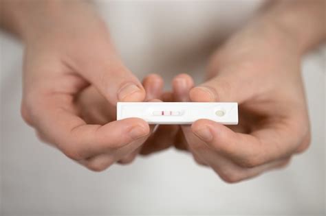 Premium Photo Hands Showing A Pregnancy Test