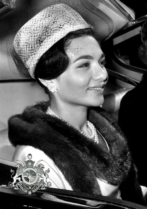 A Black And White Photo Of A Woman In A Car Wearing A Fur Stoler