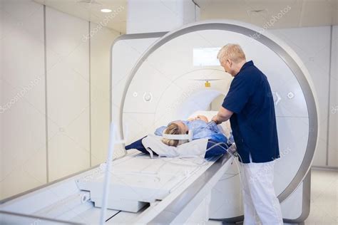 Radiologist Preparing Woman For MRI Scan Stock Photo by ©SimpleFoto ...