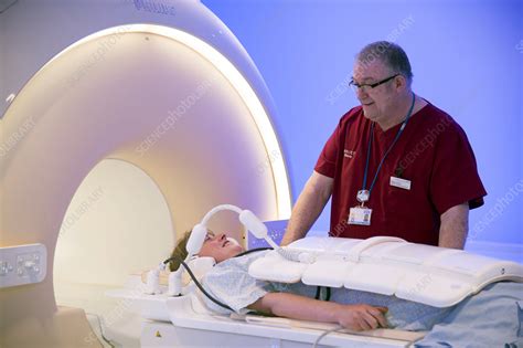 Radiographer preparing an MRI scan - Stock Image - C025/7066 - Science ...