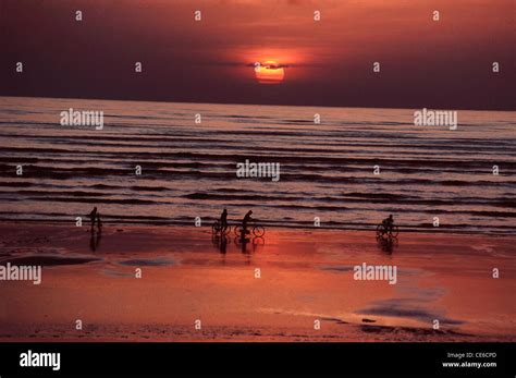 Sunset at beach ; Tithal ; Gujarat india Stock Photo - Alamy