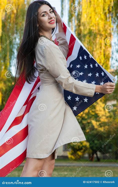 Beautiful Young Woman with Classic Dress Holding American Flag in the ...