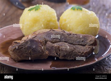 Bayerischer Schweinebraten Mit Kartoffelknodeln Hi Res Stock