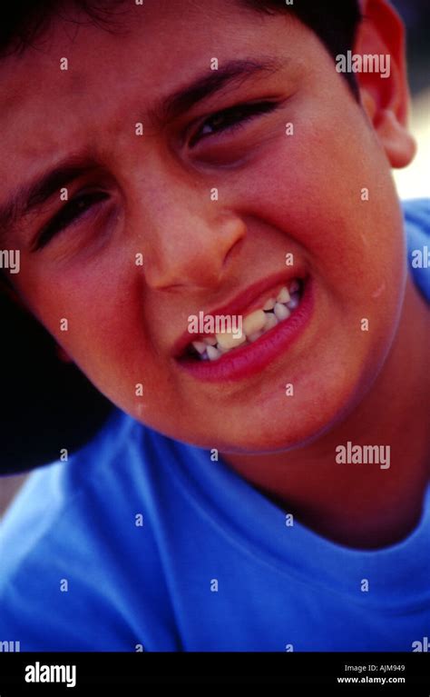 Child Face With A Mocking Smile Stock Photo Alamy