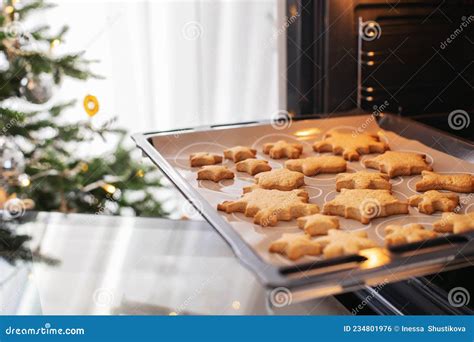 Baking Tray With Ginger Christmas Cookies Snowflakes In The Oven Stock