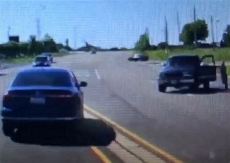 Cop Surprised As Stranger Jumps Into Moving Car Quickly Realizes Hes