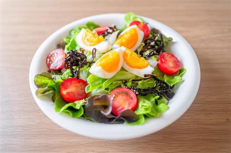 premium photo green vegetable salad  leavetomatoesboiled eggs