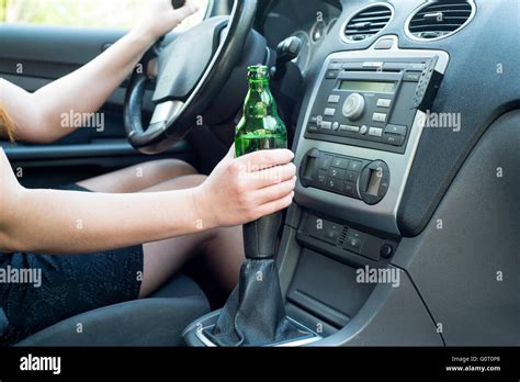 Picture Of Woman Drinking Alcohol In The Car Stock Photo Alamy