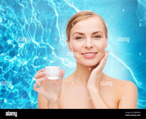 Woman Applying Cream On Her Skin Stock Photo Alamy