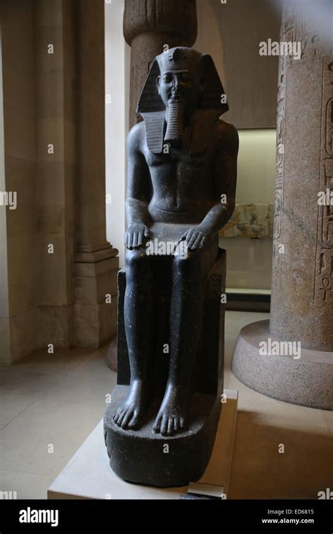 Egyptian sculpture inside Louvre museum Stock Photo - Alamy