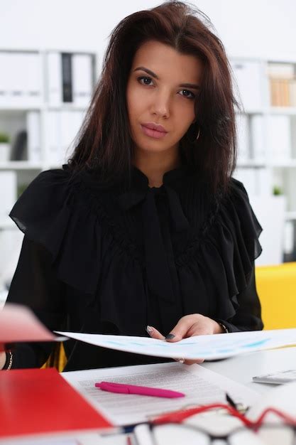 Beautiful Smiling Brunette Woman Sits At Table Premium Photo