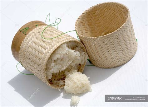 Bamboo basket of sticky rice — shadows, lifestyle - Stock Photo ...