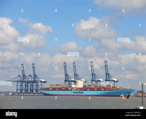 A Maersk Freight Ship Loaded With Containers With The Gantry Cranes On