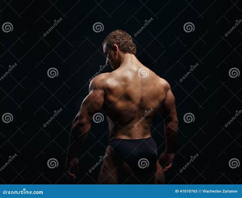 Modelo Masculino Muscled Que Mostra O Seu Traseiro Imagem De Stock