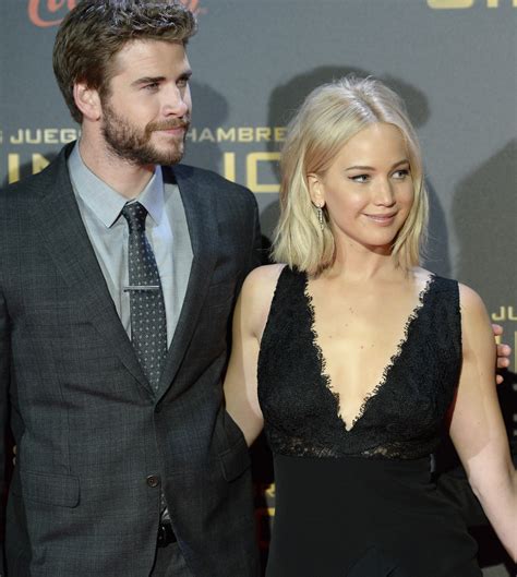 Jennifer Lawrence says she did kiss Liam Hemsworth, but not while he