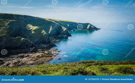 Beautiful Green Cliffs Landscape By The Blue Atlantic Ocean Near Post