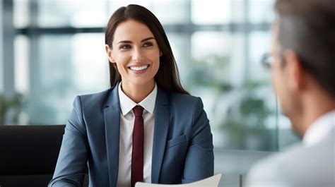 Premium Photo Smiling Female Manager Interviewing An Applicant In Office