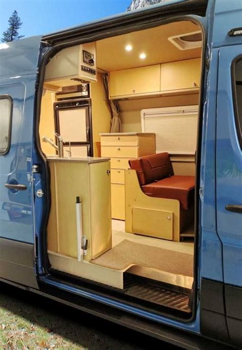 The Interior Of An Rv With Its Door Open