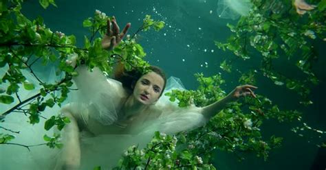 Cute Slender Mermaid Girl Under Water Swims Like In A Dream In Underwater Vegetation Stock