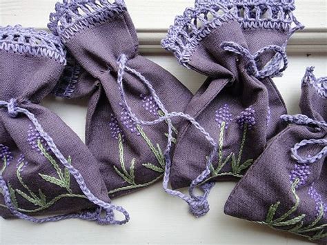 Four Purple Cloth Bags With Lavender Flowers On Them