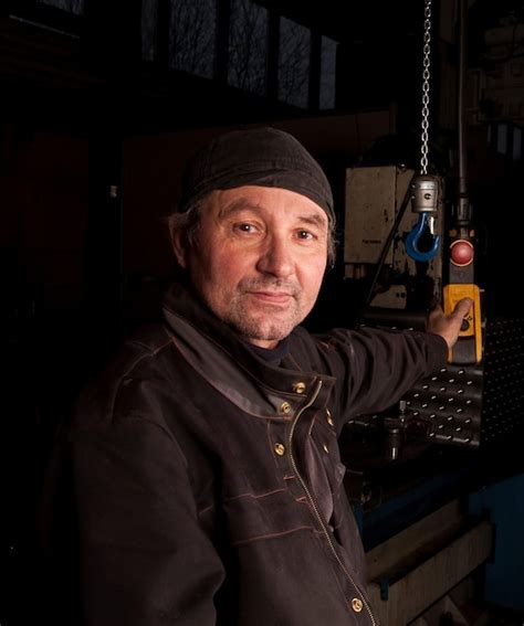 Premium Photo Portrait Of Man Standing In Factory