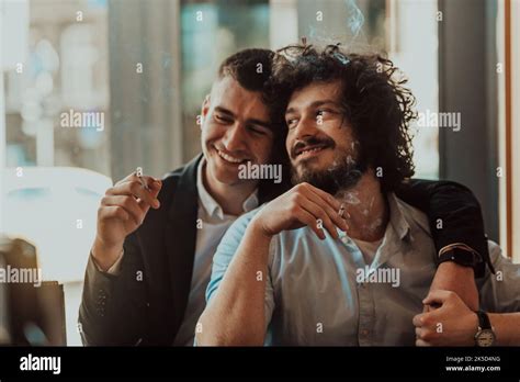 Portrait Of Multiethnic Diverse Gay LGBT Romantic Male Couple Embracing And Showing Their Love