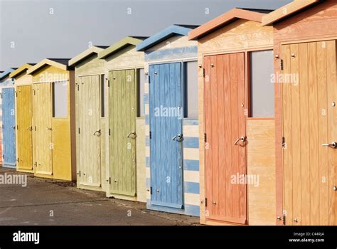 Row Of Pastel Coloured Beach Huts On The Beach At Seaford In East