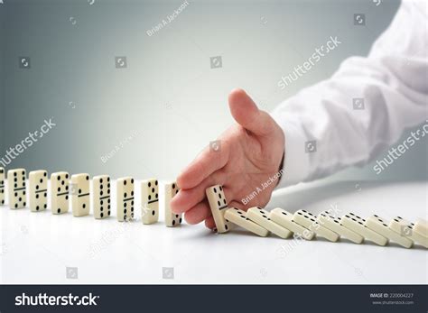 Stopping The Domino Effect Concept For Business Solution Strategy And