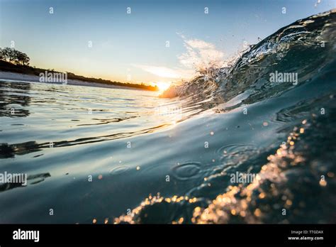 wave at sunrise Stock Photo - Alamy