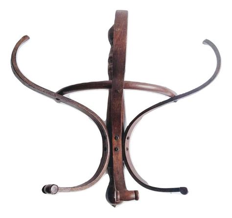 a wooden coat rack with two hooks on it