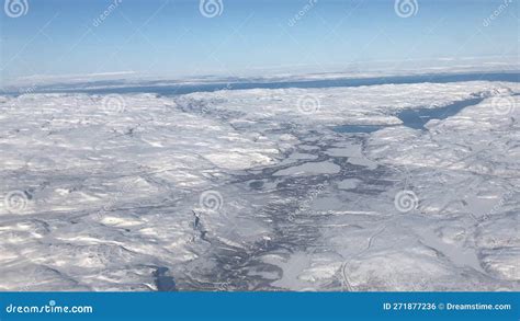 View From Plane Window Over Snow Covered Troms Norway Stock Photo