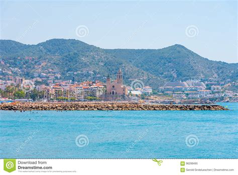 Stony Beach And Church Of Sant Bartomeu And Santa Tecla In Sitges