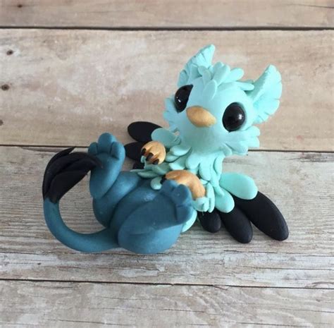 Aqua gryphon by Dragonsandbeasties | Polymer clay crafts, Polymer clay ...