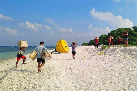 LOOK: Civilian resupply mission arrives in Lawak Island | ABS-CBN News