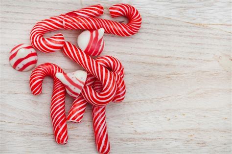 Premium Photo Small Candy Canes And Red And White Sweets With Copy Space