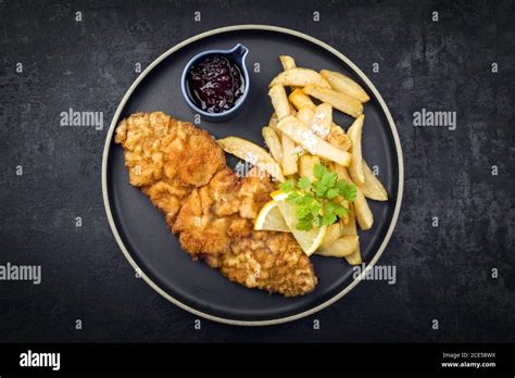 Fried Wiener Schnitzel From Veal Topside With French Fries And