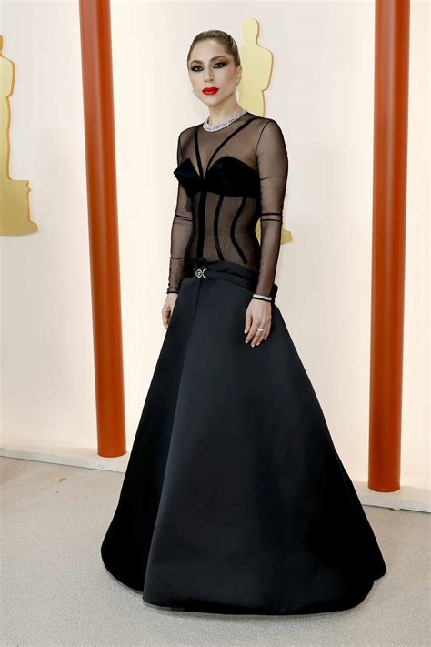 Lady Gaga Stunned at the 2023 Oscars Red Carpet in a Sheer Versace Gown