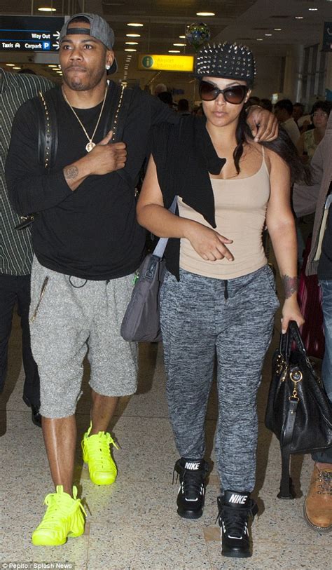 Nelly Keeps His Muscular Arm Around Girlfriend Shantel Jackson As He