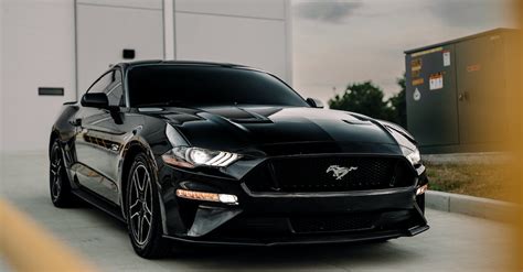 Black Ford Mustang Behind the Fence · Free Stock Photo