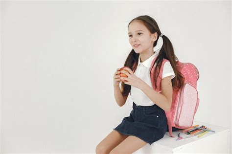 Premium Photo Beautiful Schoolgirl Eating Apple Isolated