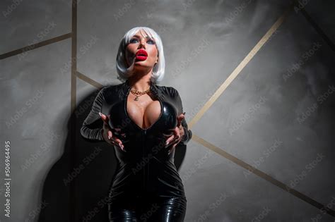 Sexy Woman In A Blonde Wig And Latex Catsuit Role Playing Games Stock