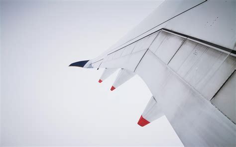 Itap Of Wing Of An Airplane Covered In The Clouds Scrolller