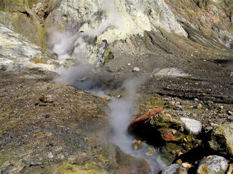 Premium Photo Hot Spring Emitting Steam On Volcanic Landscape