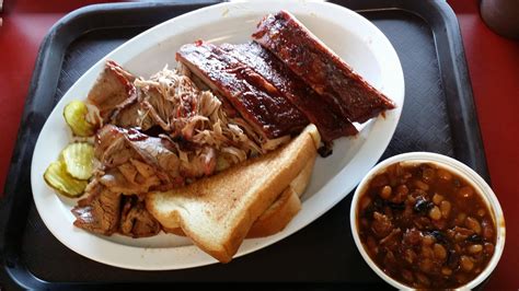 Oklahoma Joe's. Ribs, brisket, pulled pork and beans. Dam good. : food