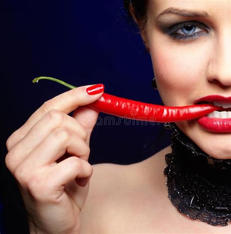 Beautiful Brunette Woman With Chili Pepper