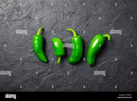 Green Jalapeno Hot Pepper In Wooden Plate Stock Photo Alamy