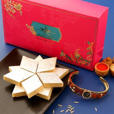 Send Om And Rudraksha Bracelet Rakhi With Kaju Katli Online