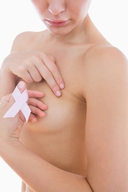 Premium Photo Naked Woman Holding Breast Cancer Ribbon