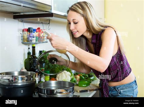 Beautiful Blonde Cooking Soup In The Kitchen Stock Photo Alamy